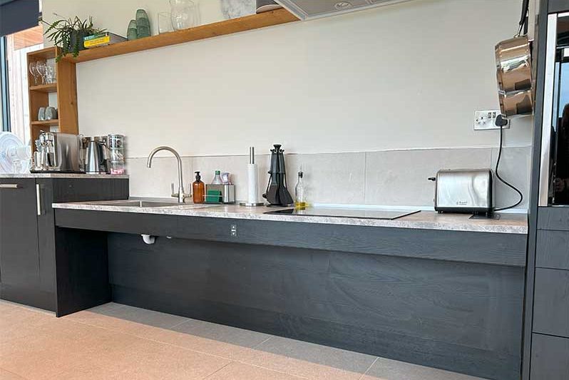 `Black accessible kitchen adjustable worktop`