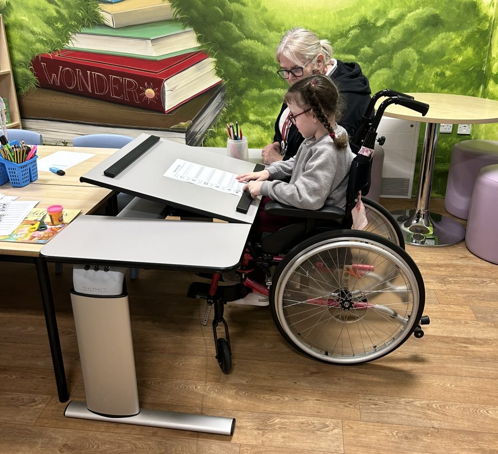 wheelchair user at accessible desk