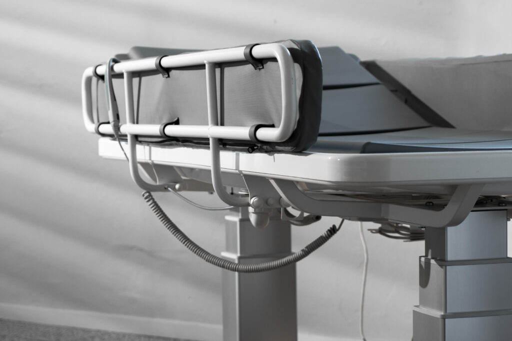MobiCare electric shower stretcher with hand control