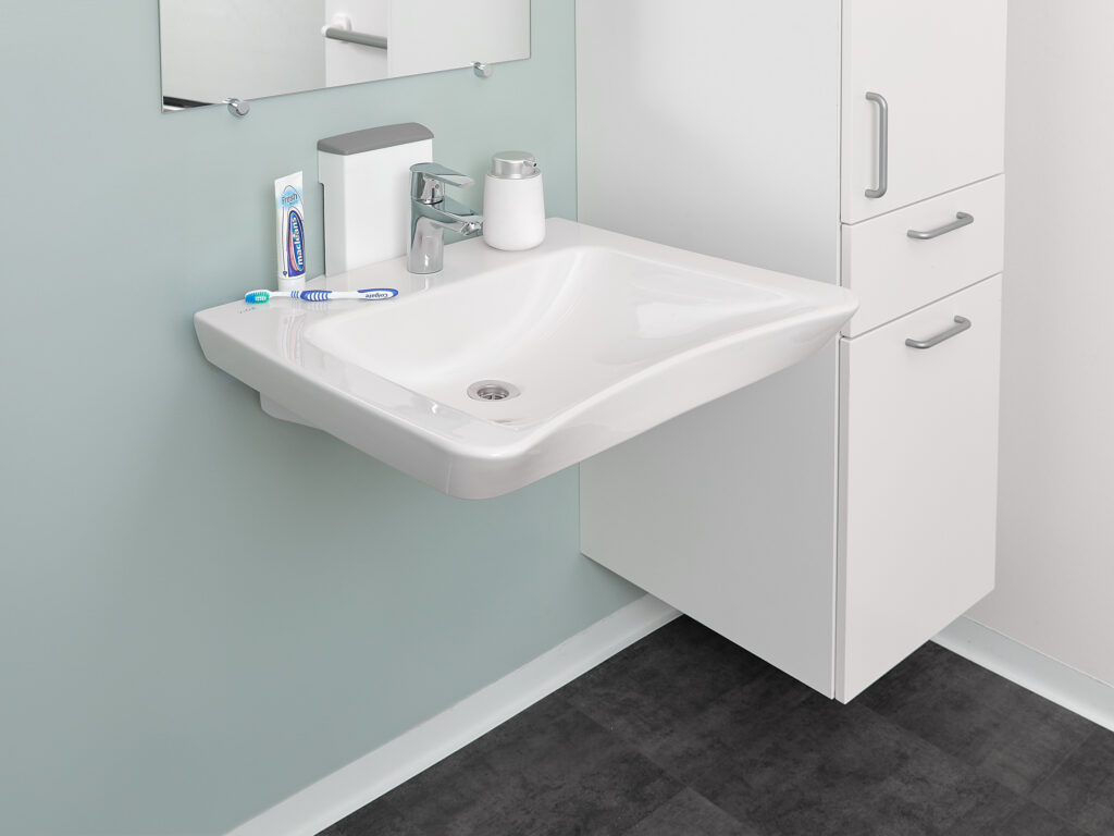 Adaptline washbasin with handle for height adjustment