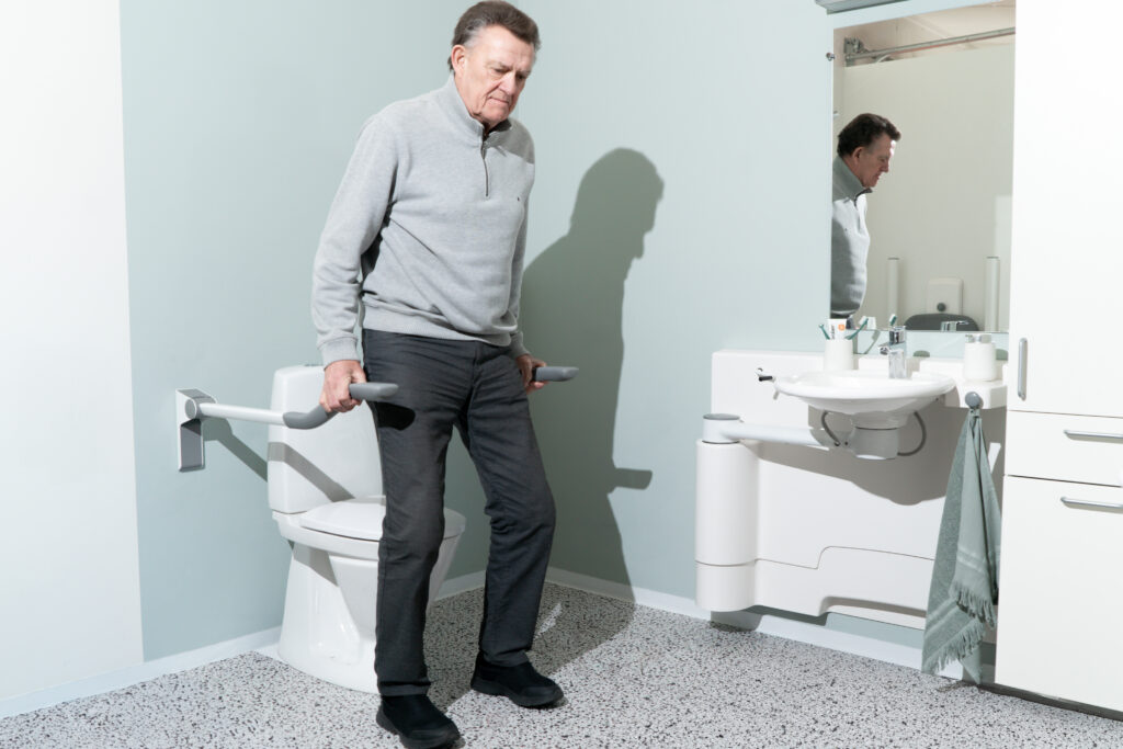 toilet support arms with user